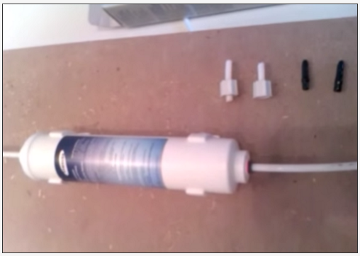 How do I install the water filter in my fridge?