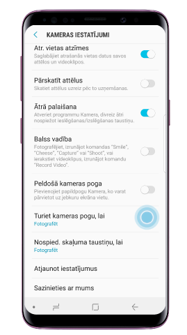 Nospied “Turēt kameras pogu”