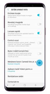 Apăsați pe Menținere buton cameră pentru